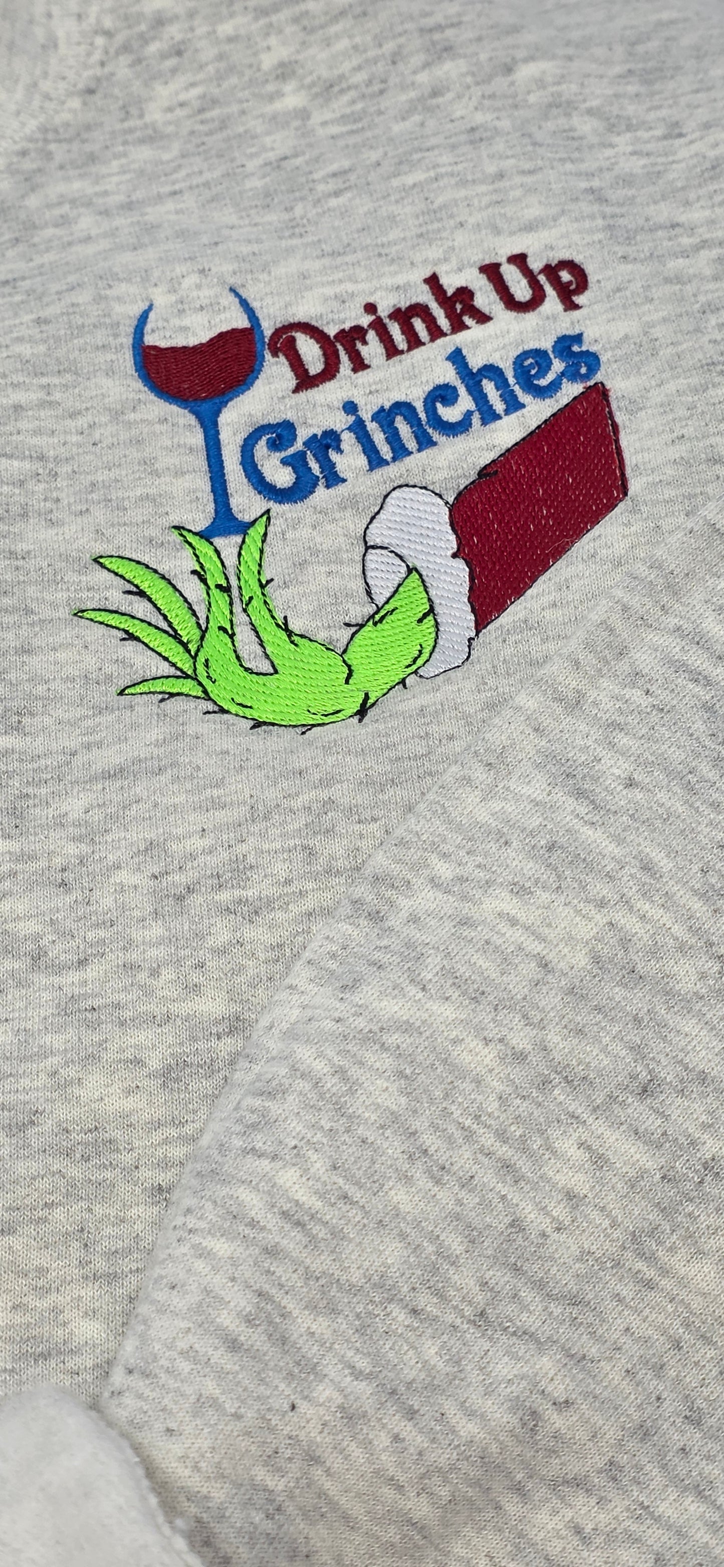 Drink Up Grinches Embroidered Holiday Crewneck Sweatshirt with Front Pocket