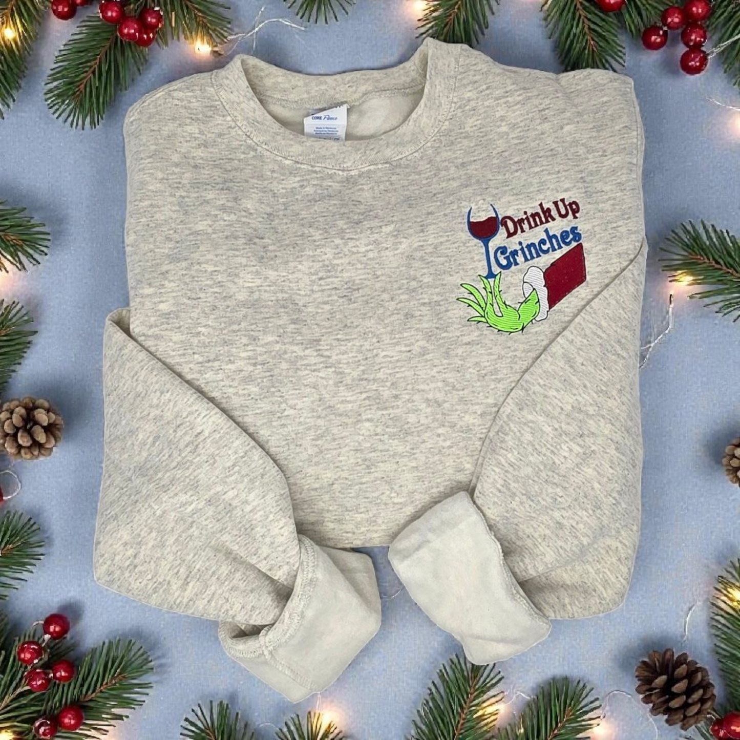 Drink Up Grinches Embroidered Holiday Crewneck Sweatshirt with Front Pocket