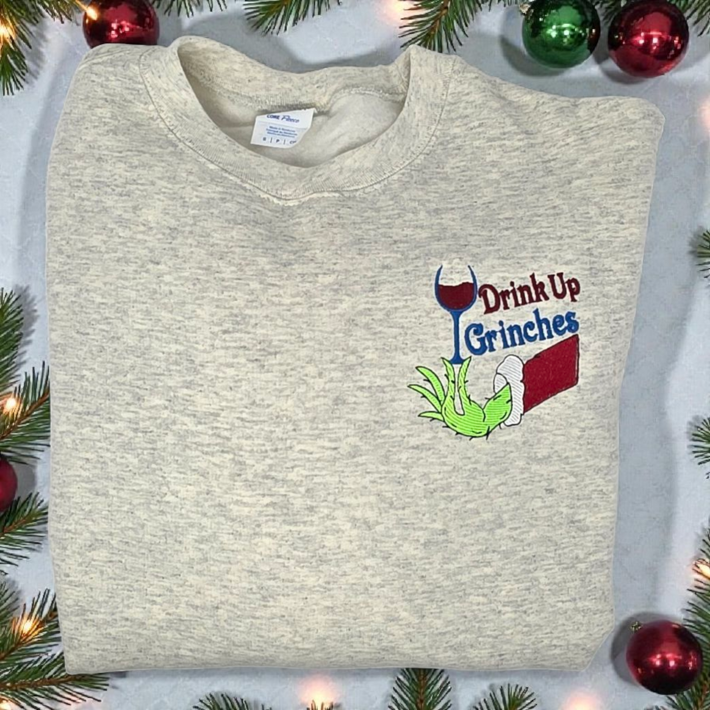 Drink Up Grinches Embroidered Holiday Crewneck Sweatshirt with Front Pocket