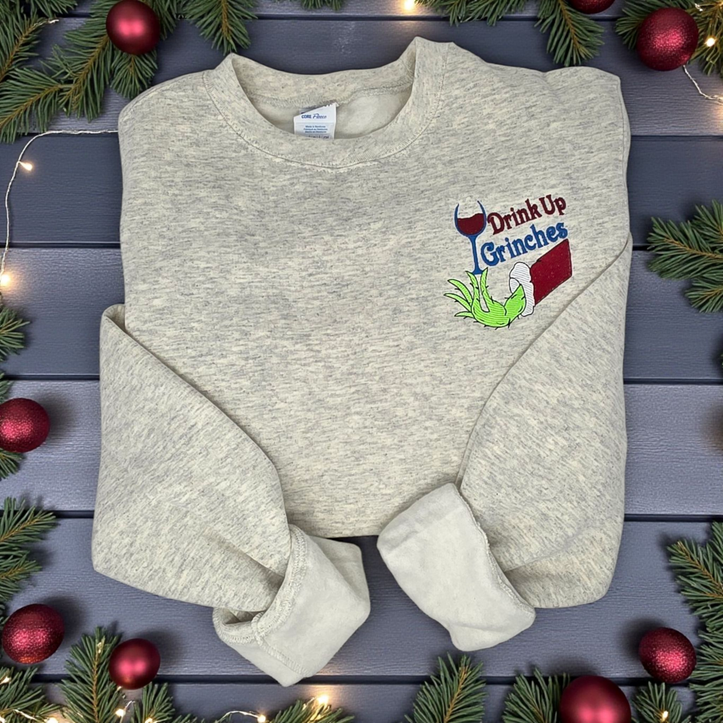 Drink Up Grinches Embroidered Holiday Crewneck Sweatshirt with Front Pocket