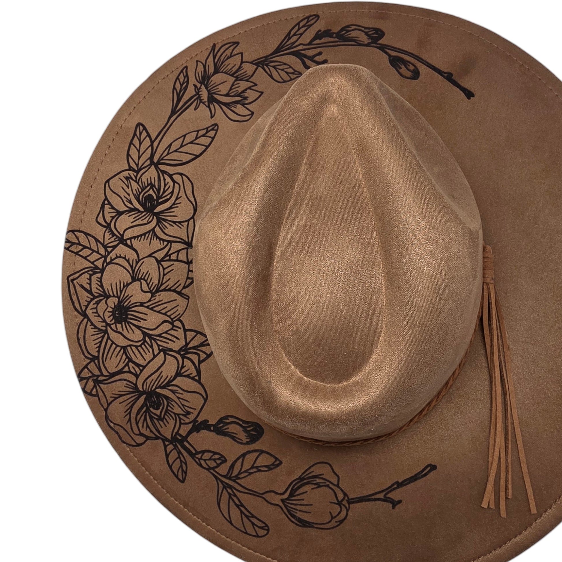 Elkhorn Designs chestnut vegan suede wide brim hat with laser-engraved gardenia floral design and tassel detail.